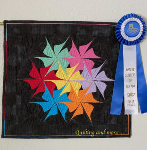 quilt with blue ribbon