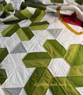 Green "petals" surrounded by white and grey background.